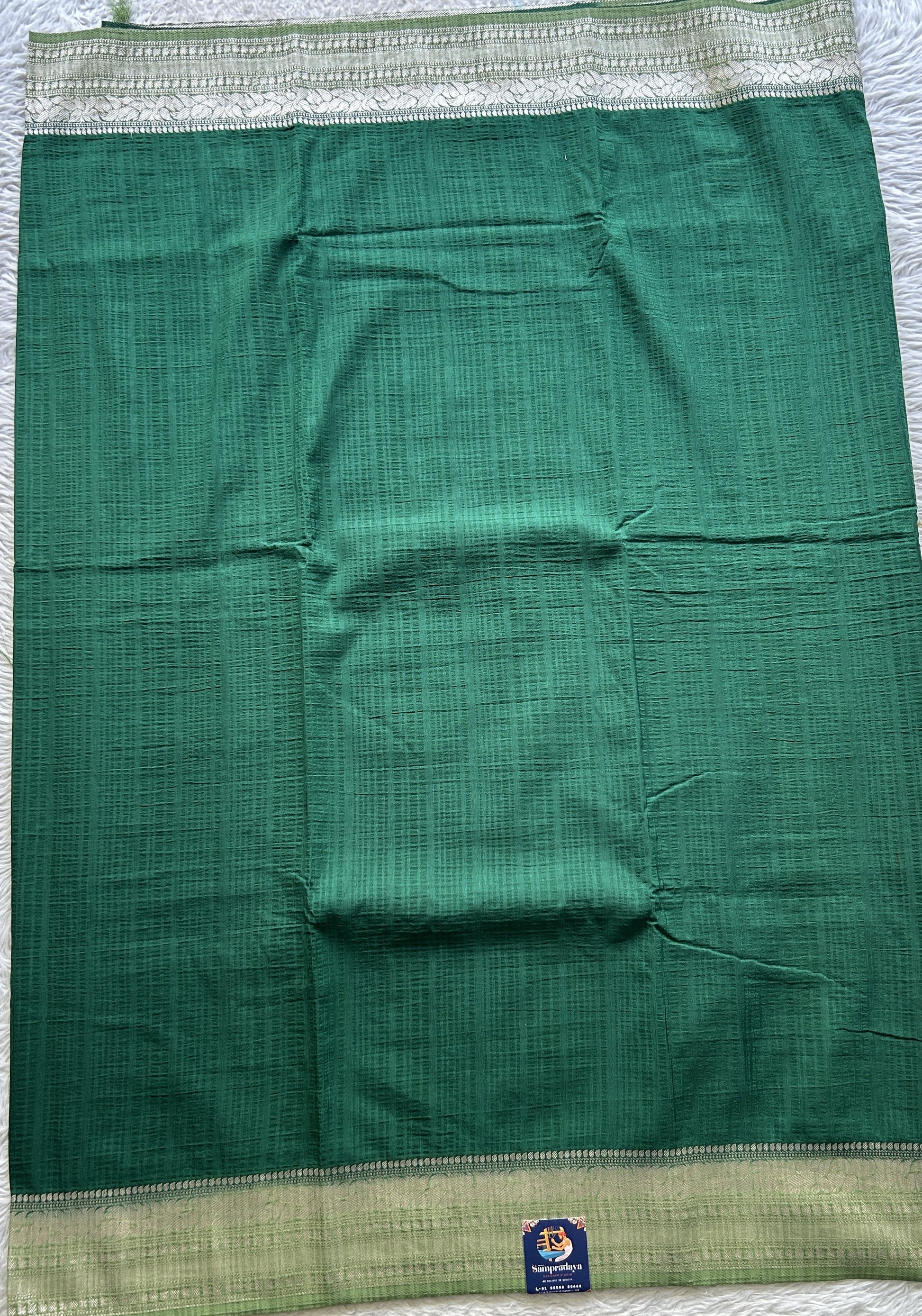Semi Georgette Plain Saree Dark Green Colored Elegantly Paired with a Zari Border. - Sampradaya Designer Studio