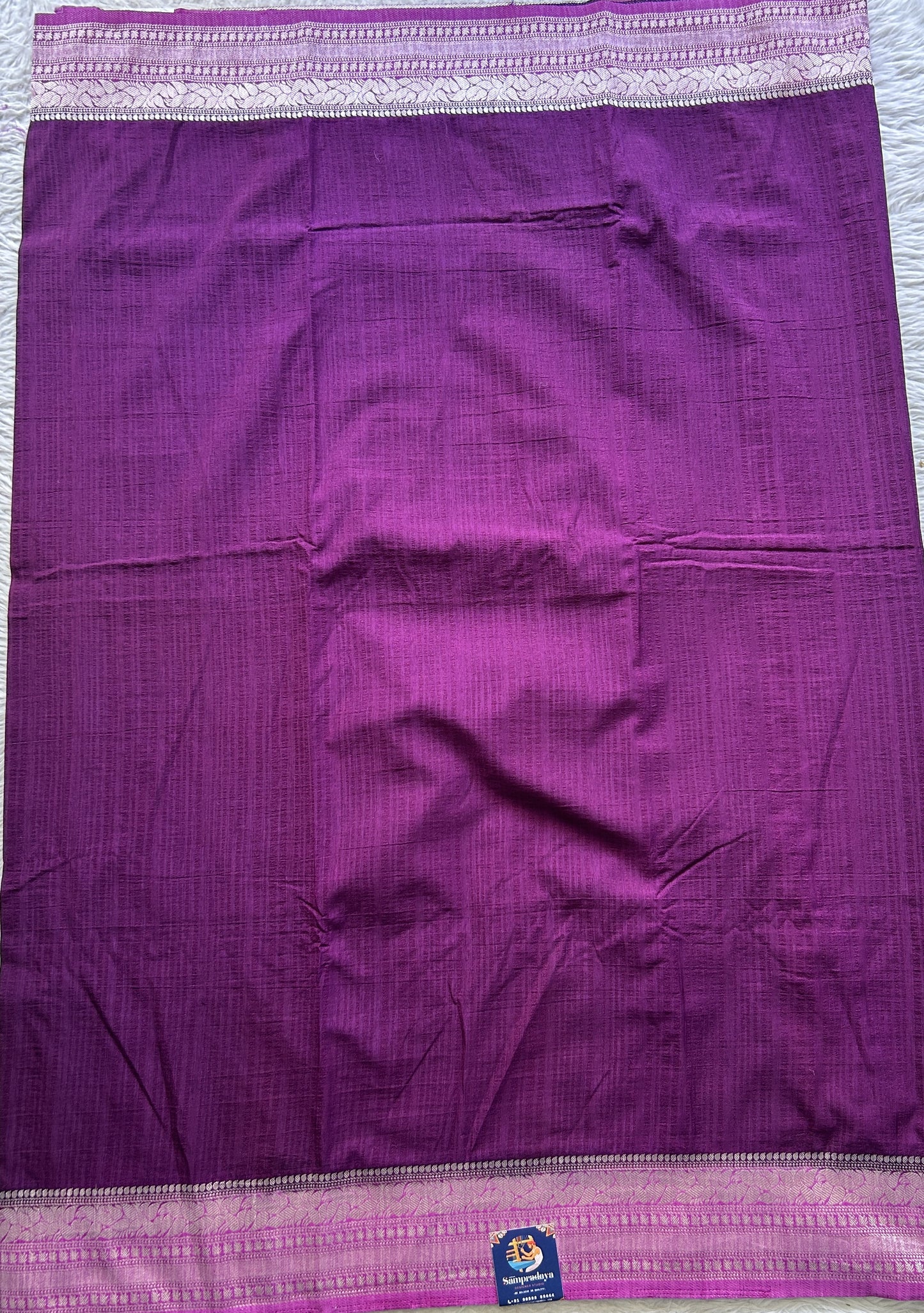 Semi Georgette Plain Saree Dark Purple Colored Elegantly Paired with a Zari Border. - Sampradaya Designer Studio