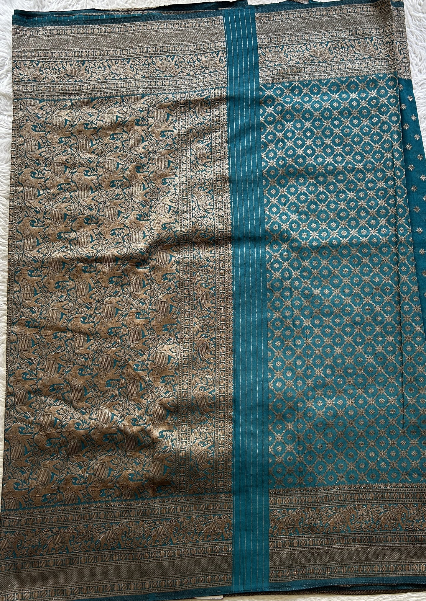 Semi Georgette Saree Teal Blue Colored Elegantly Paired with a Zari Border. - Sampradaya Designer Studio