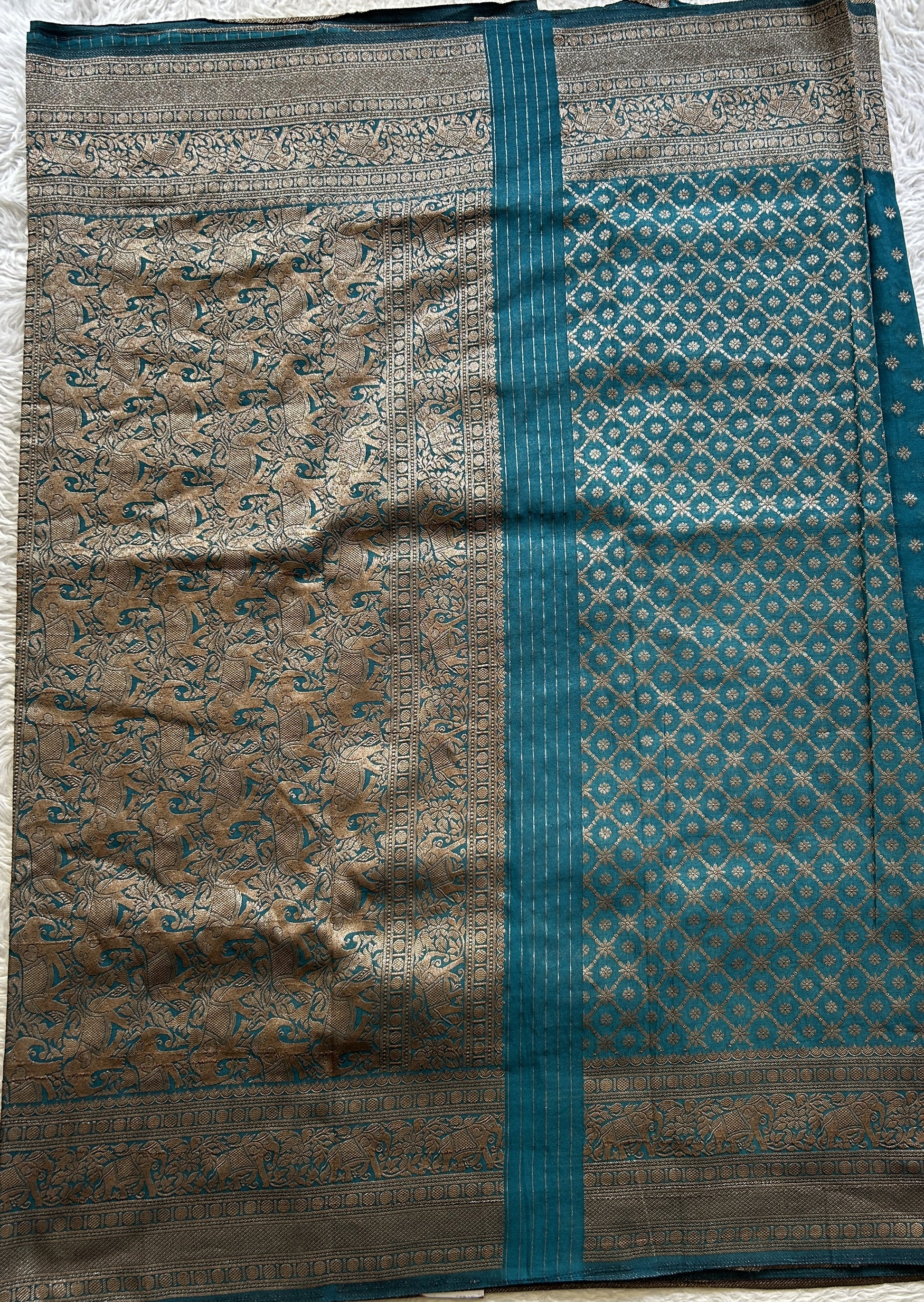 Semi Georgette Saree Teal Blue Colored Elegantly Paired with a Zari Border. - Sampradaya Designer Studio