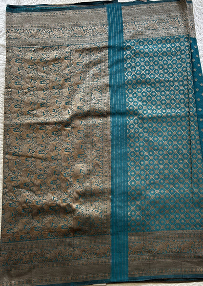 Semi Georgette Saree Teal Blue Colored Elegantly Paired with a Zari Border. - Sampradaya Designer Studio
