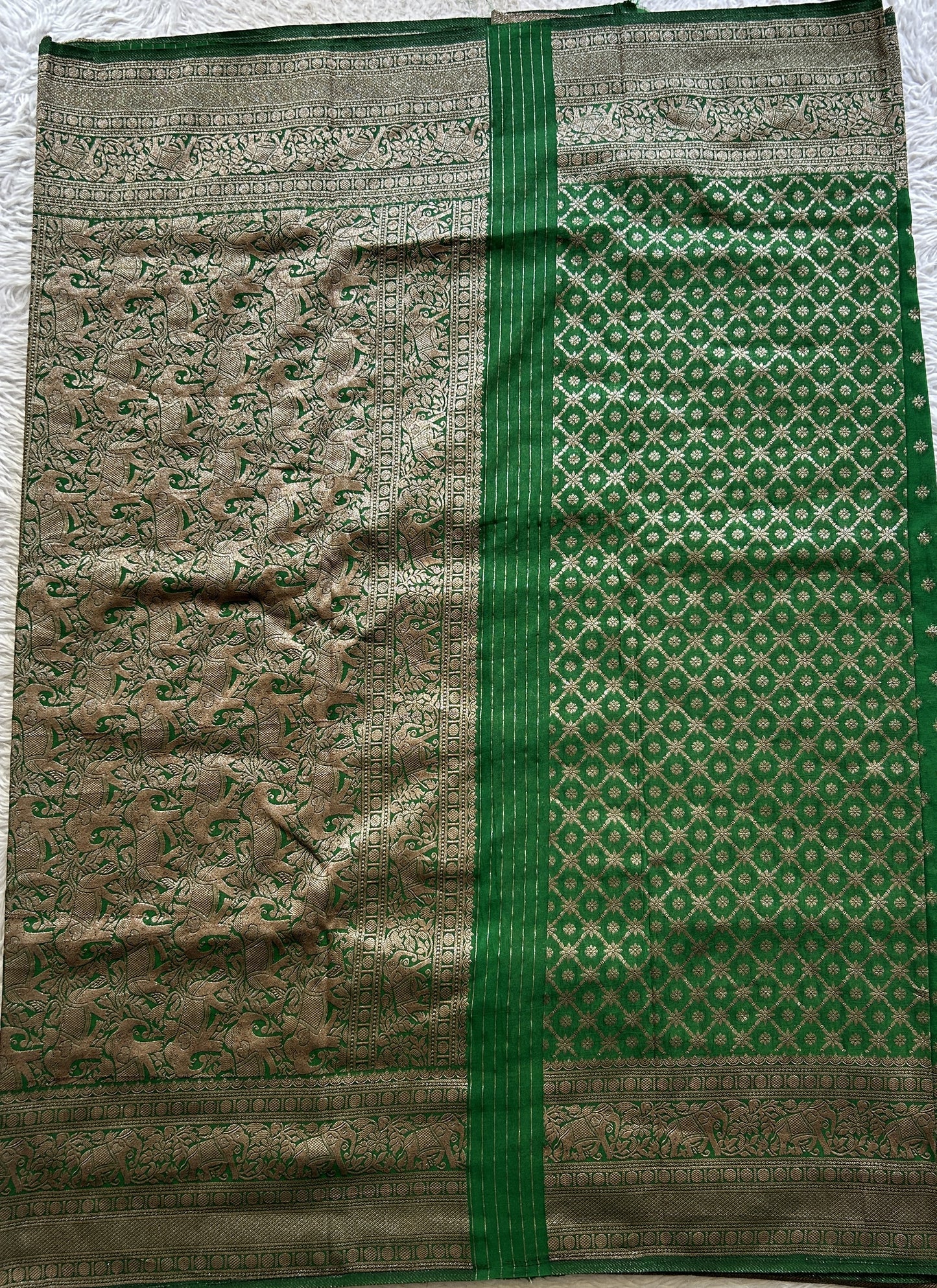 Semi Georgette Saree Leaf Green Colored Complemented with a Zari Border. - Sampradaya Designer Studio
