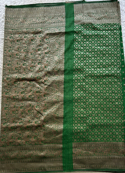 Semi Georgette Saree Leaf Green Colored Complemented with a Zari Border. - Sampradaya Designer Studio
