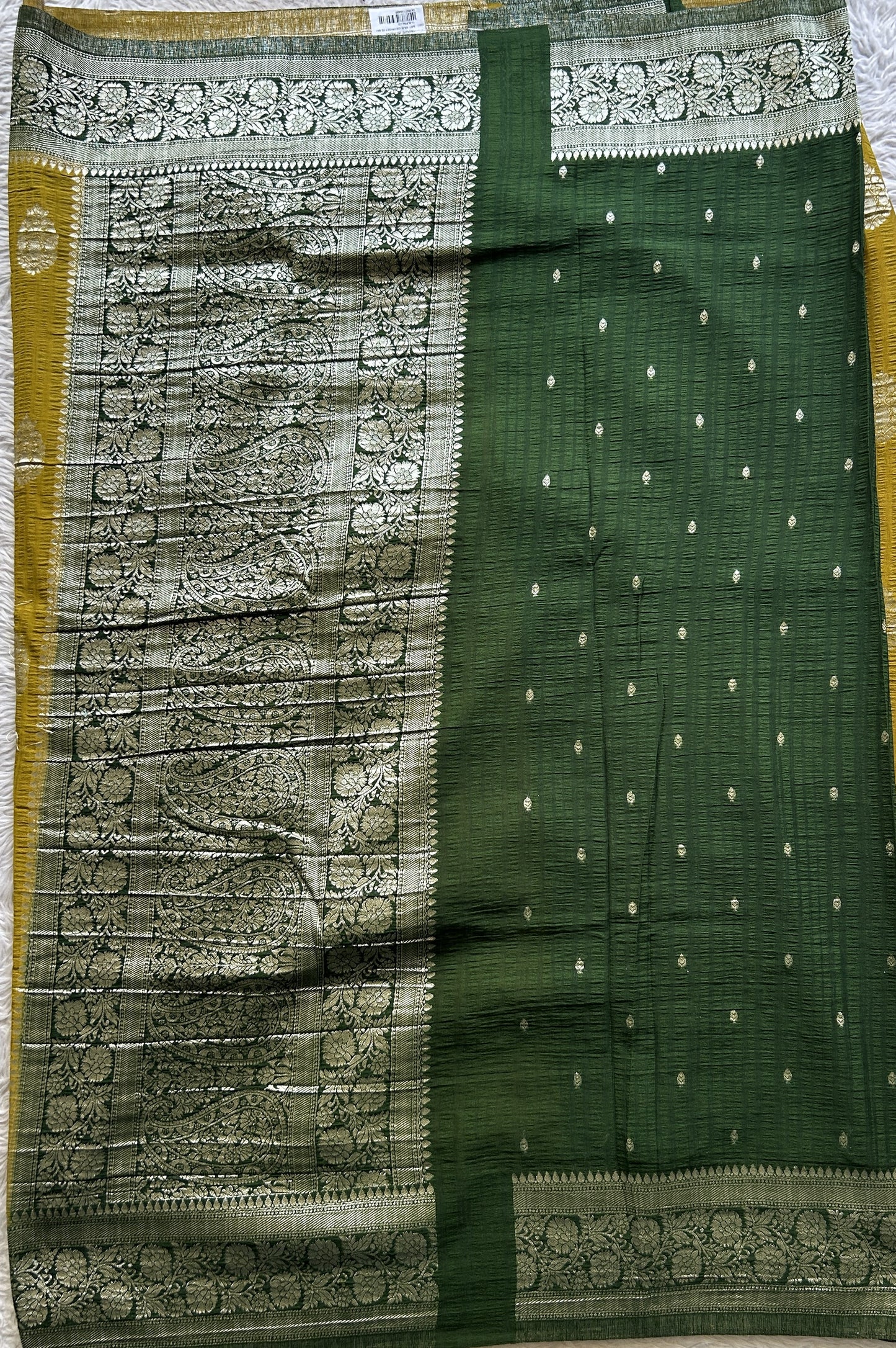 Semi Georgette Saree Mustard Colored Complemented with a Green Zari Border. - Sampradaya Designer Studio