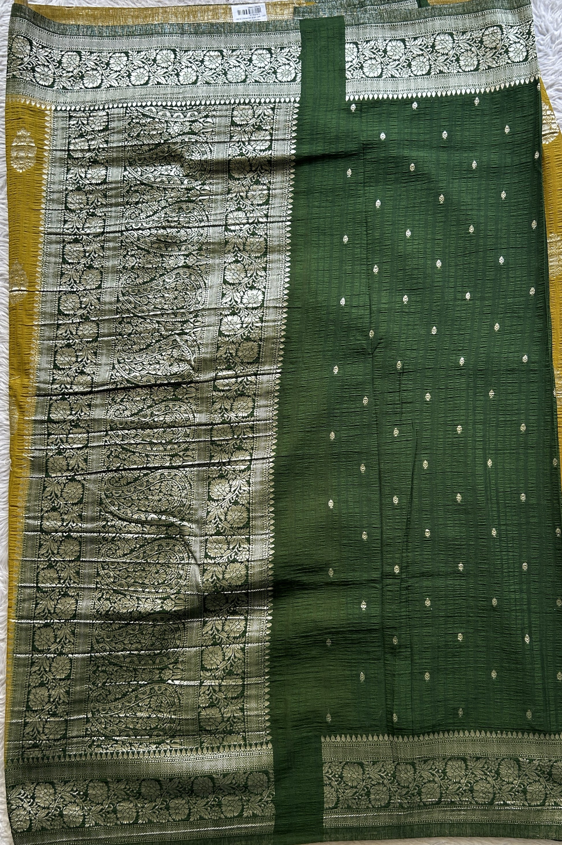 Semi Georgette Saree Mustard Colored Complemented with a Green Zari Border. - Sampradaya Designer Studio