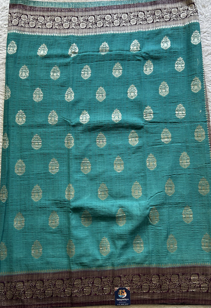 Semi Georgette Saree Aqua Blue Colored Complemented with a Purple Zari Border. - Sampradaya Designer Studio