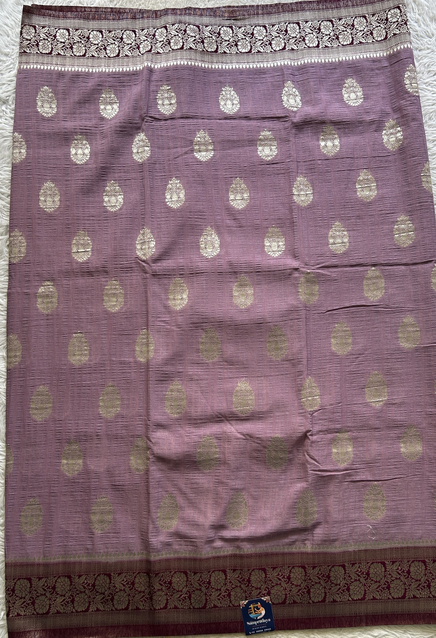 Semi Georgette Saree Lavender Colored Complemented with a Purple Zari Border. - Sampradaya Designer Studio