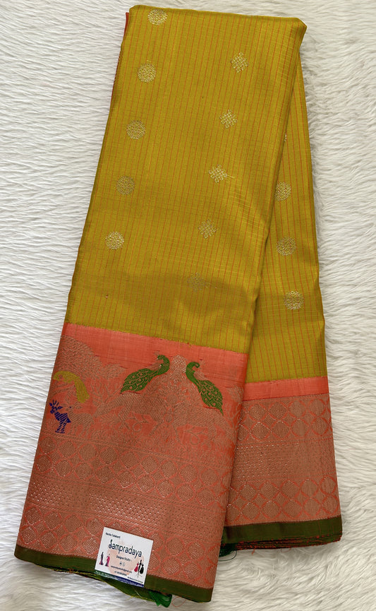 Gadwal Pattu Turmeric Yellow Colored Saree Complemented With a Pattu Orange Color Kanchi Border - Sampradaya Designer Studio