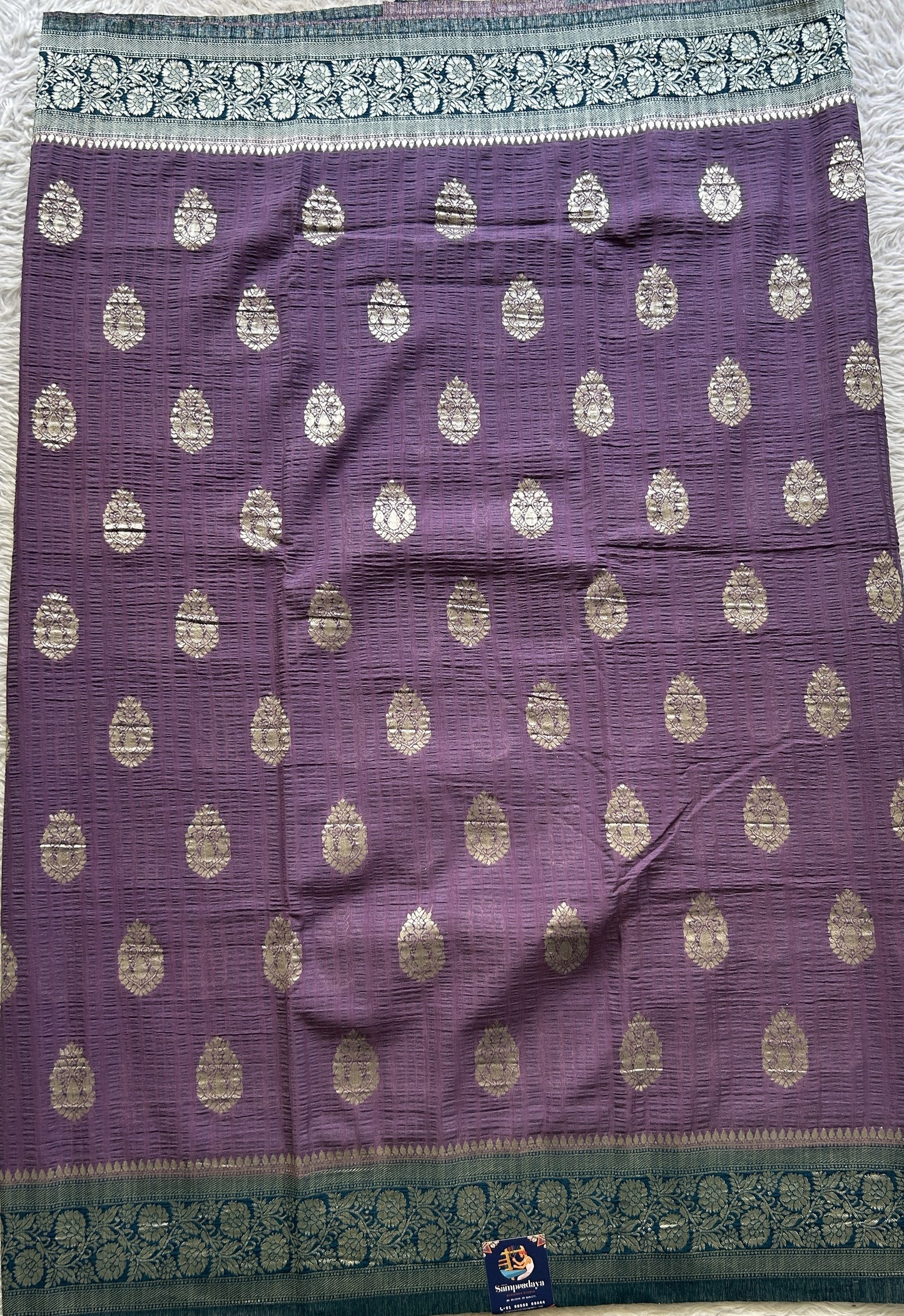 Semi Georgette Saree Lavender Colored Complemented with a Peacock Blue Zari Border. - Sampradaya Designer Studio