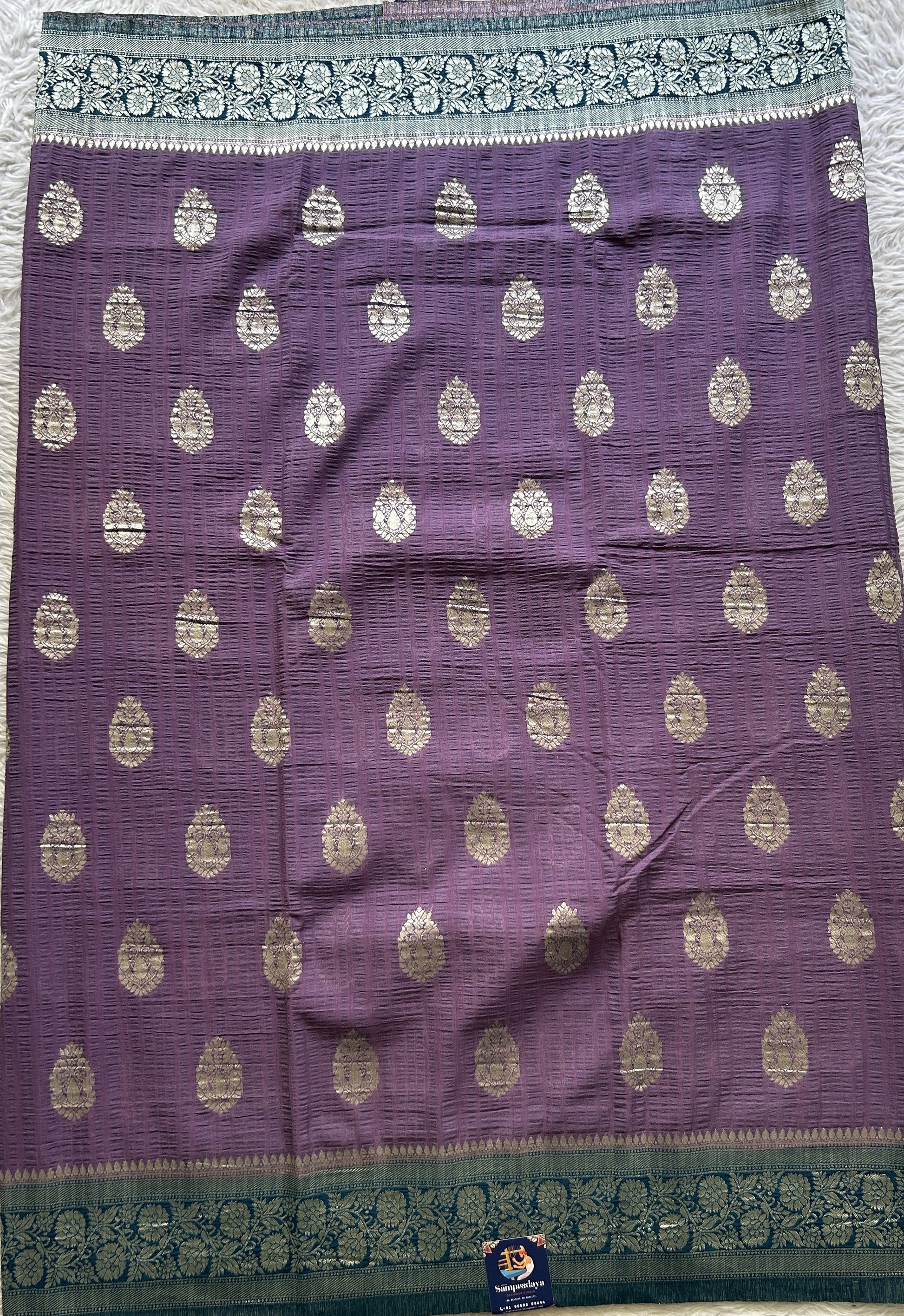 Semi Georgette Saree Lavender Colored Complemented with a Peacock Blue Zari Border. - Sampradaya Designer Studio