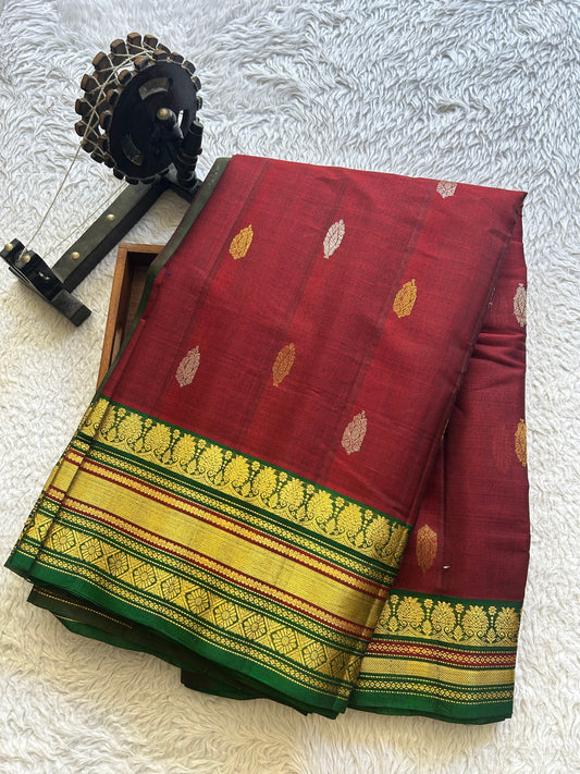 Gadwal Sico Saree  Maroon colored complemented with a Gold Zari Border