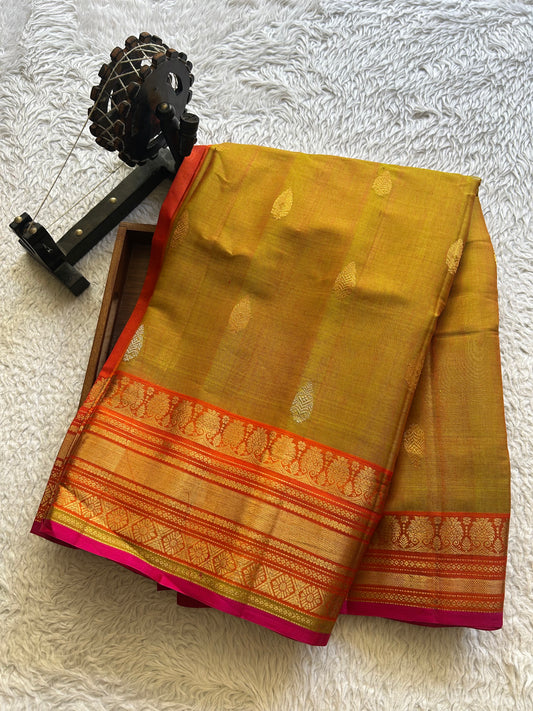 Gadwal Sico Saree Dijon Yellow colored complemented with a Gold Zari Border