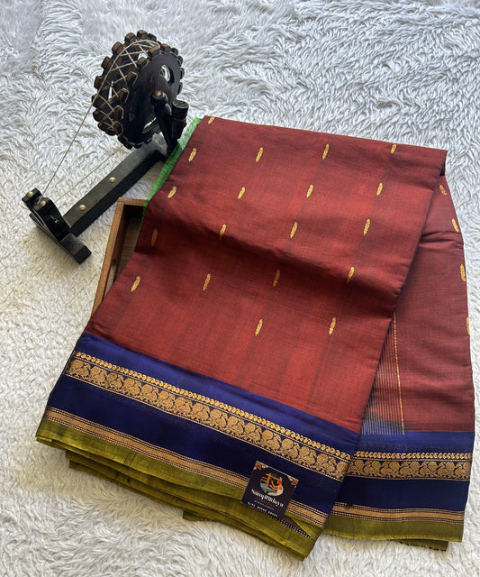 Gadwal Sico Saree Bam Maroon colored complemented with a Gold Zari Border