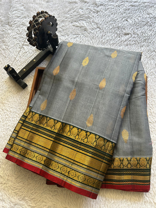 Gadwal Sico Saree Gray colored complemented with a Gold Zari Border