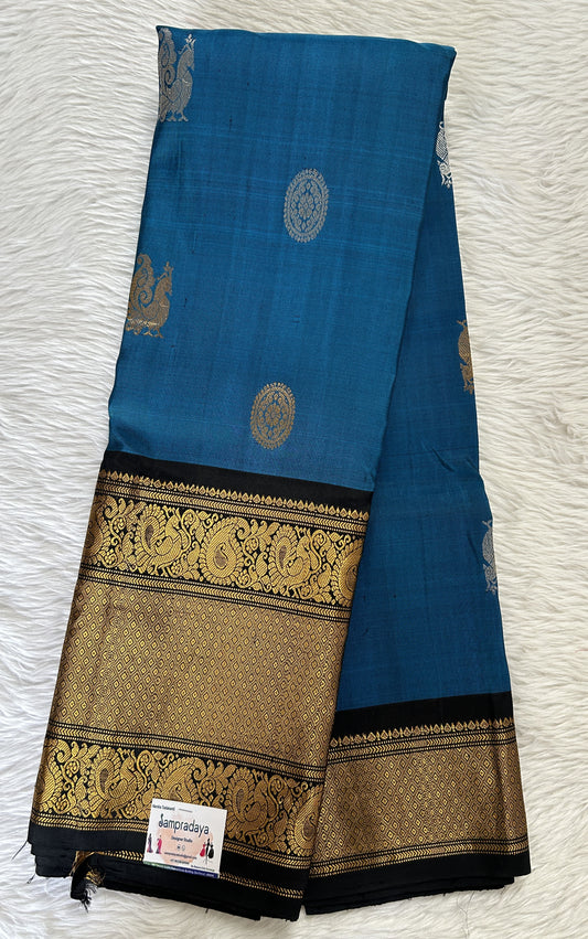 Gadwal Pattu Prussian Blue Colored Saree Complemented With a Pattu Black Color Kanchi Border - Sampradaya Designer Studio