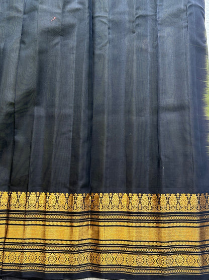 Gadwal Sico Saree Olive Green colored complemented with a Gold Zari Border