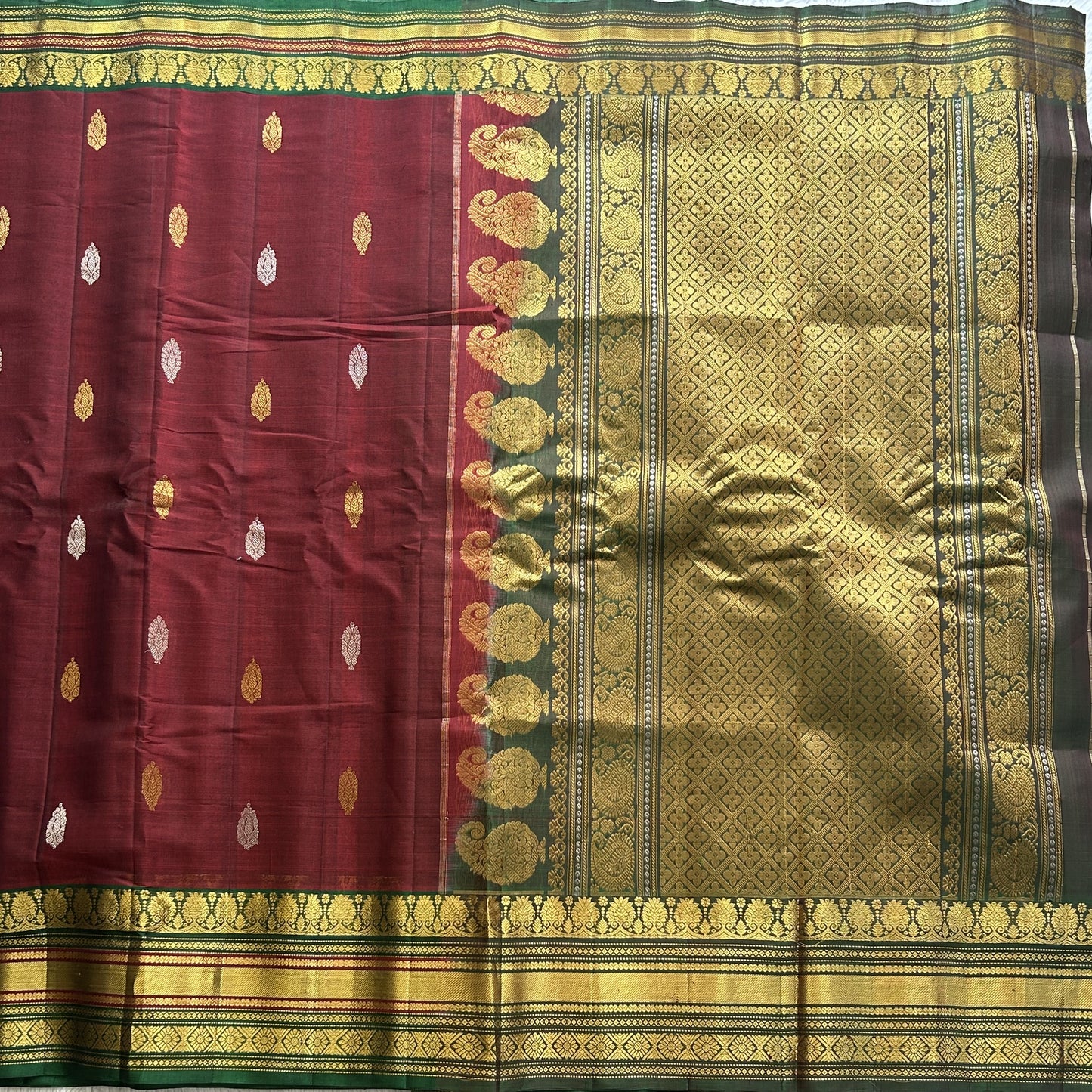 Gadwal Sico Saree  Maroon colored complemented with a Gold Zari Border - Sampradaya Designer Studio