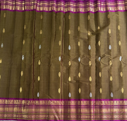 Gadwal Sico Saree Peanut colored complemented with a Gold Zari Border - Sampradaya Designer Studio