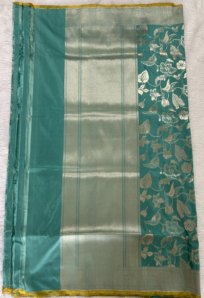 Banarasi Katan Silk Saree sea Green colored Saree complemented with a Silver Zari border. - Sampradaya Designer Studio