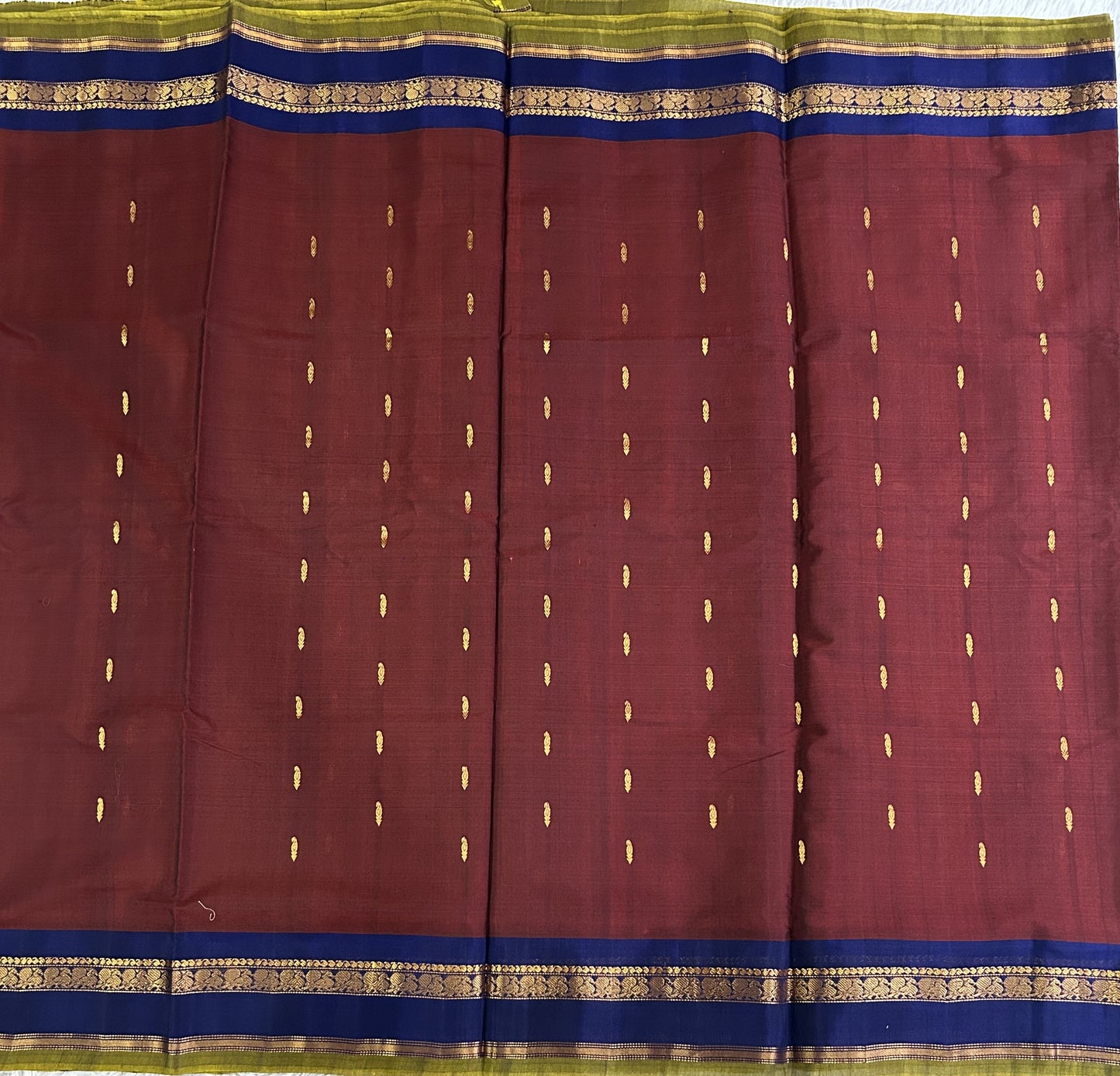Gadwal Sico Saree  Maroon colored complemented with a Gold Zari Border - Sampradaya Designer Studio