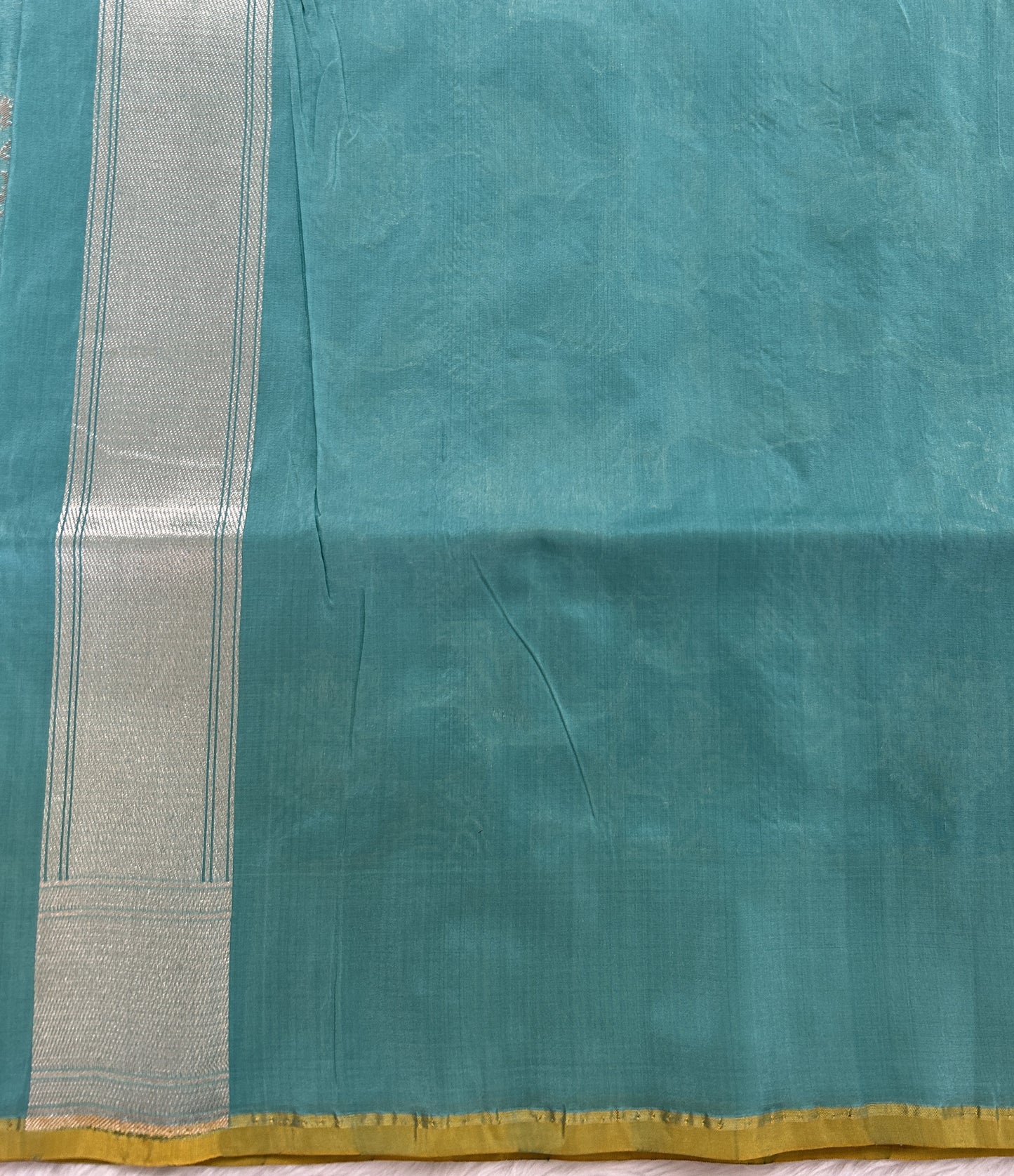 Banarasi Katan Silk Saree sea Green colored Saree complemented with a Silver Zari border. - Sampradaya Designer Studio