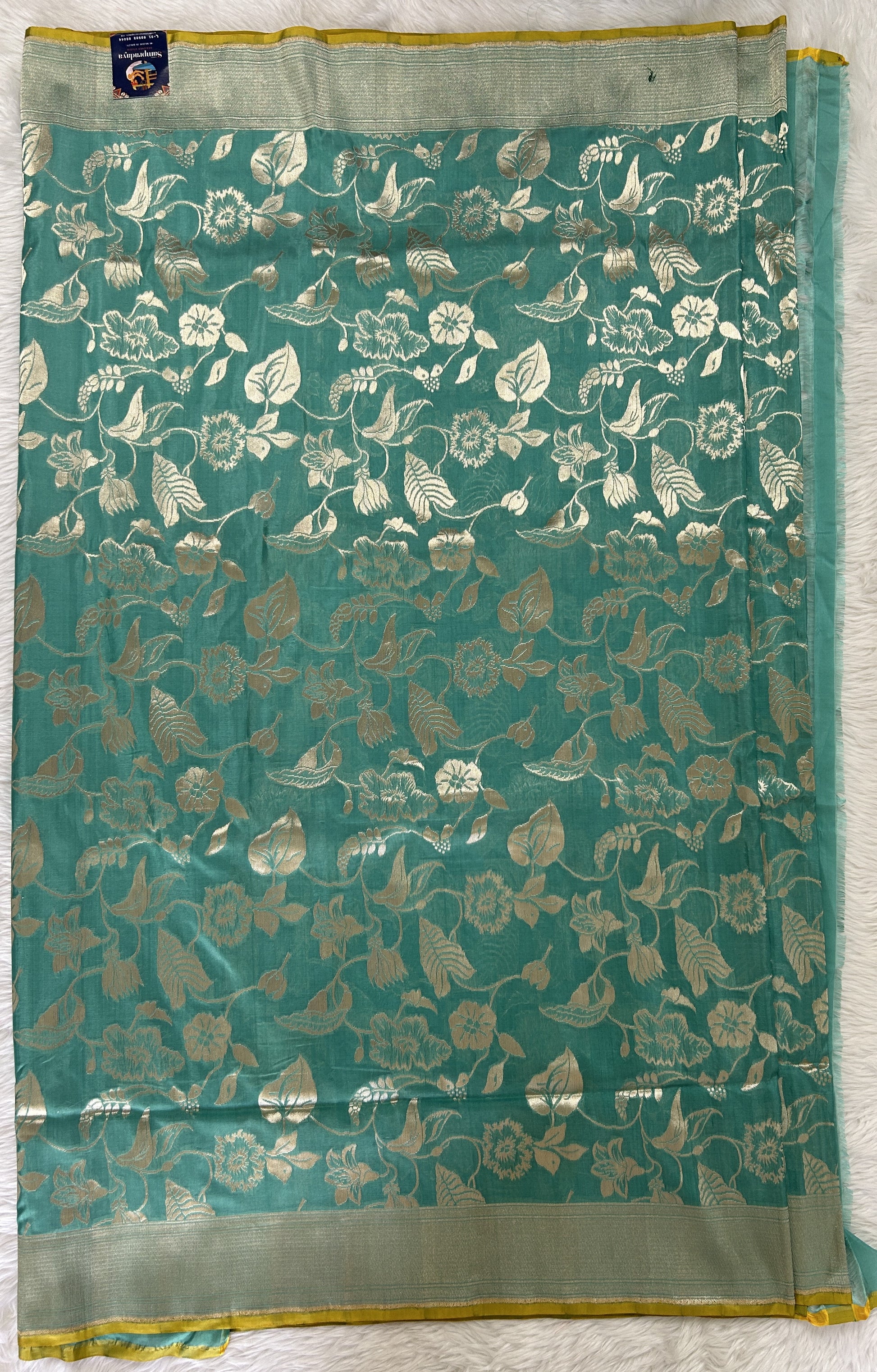 Banarasi Katan Silk Saree sea Green colored Saree complemented with a Silver Zari border. - Sampradaya Designer Studio