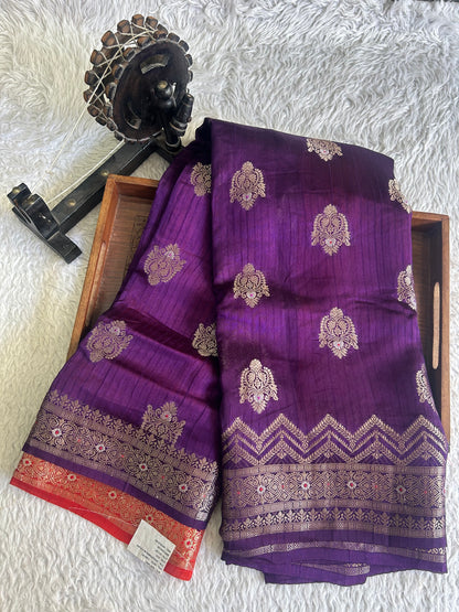 Banarasi Fancy Saree Russian Colored Complemented with a Silver Zari Border.
