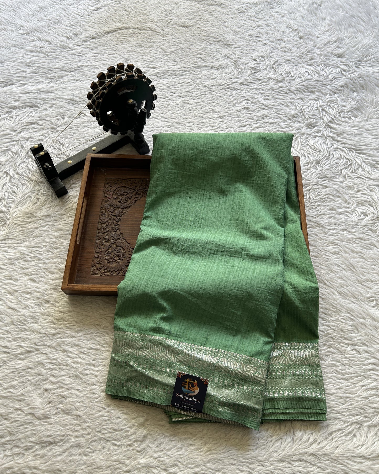 Semi Georgette Saree Sea Green Colored elegantly adorned with a Zari Border. - Sampradaya Designer Studio
