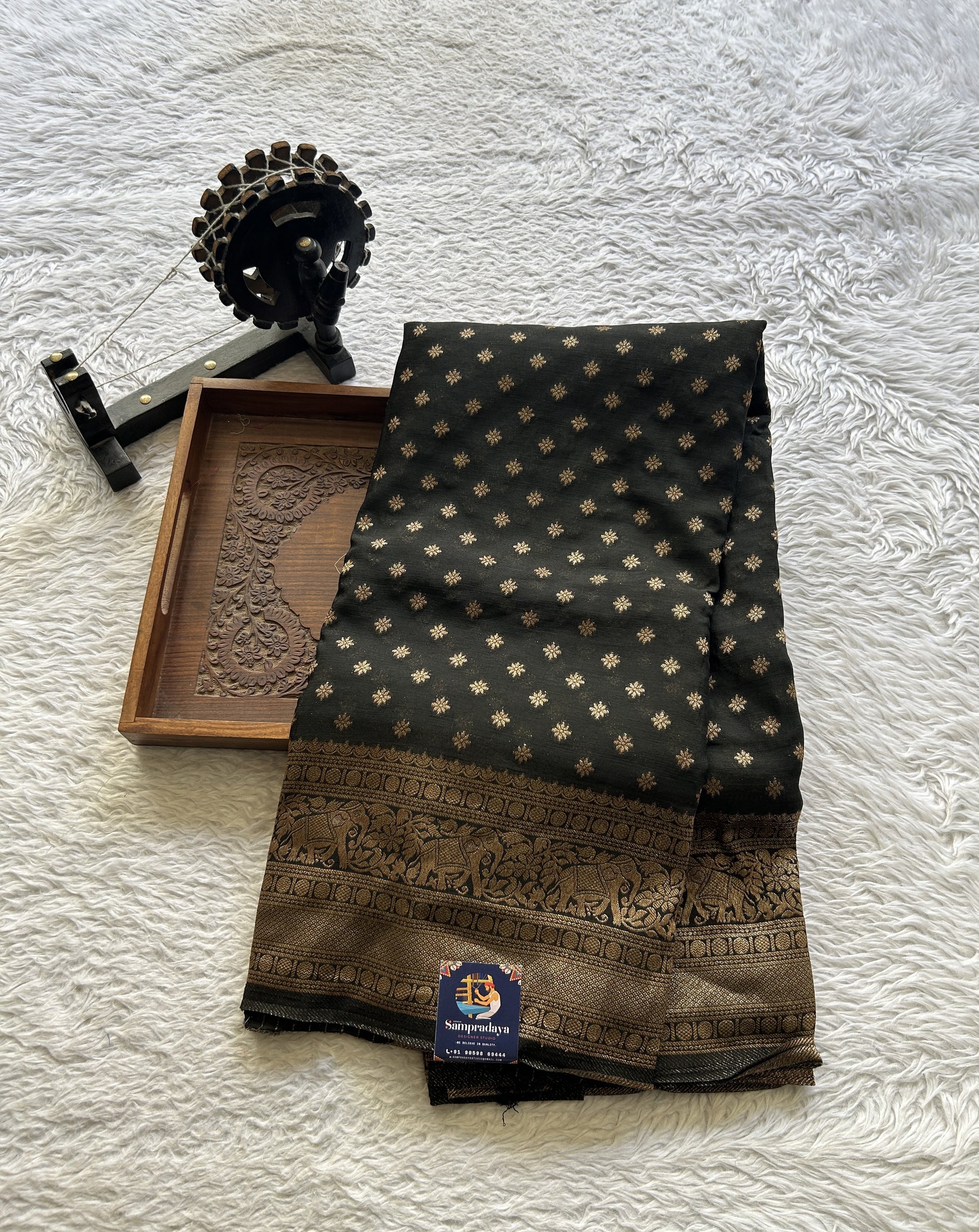 Semi Georgette Saree Black Colored elegantly adorned with a Zari Border. - Sampradaya Designer Studio