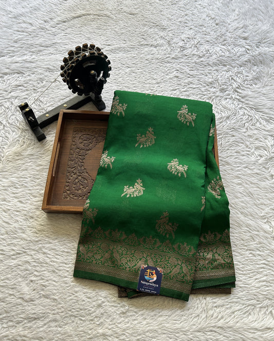 Semi Georgette Saree Green Colored elegantly adorned with a Zari Border. - Sampradaya Designer Studio