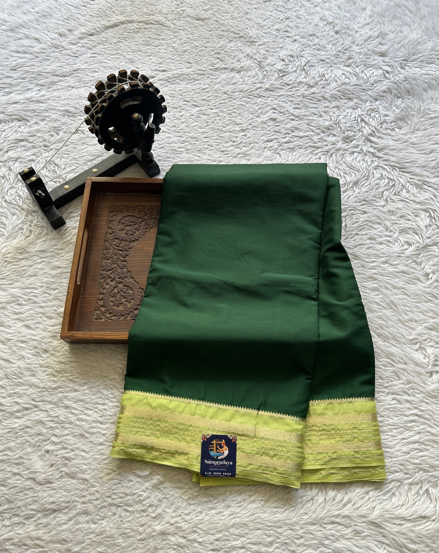Semi Georgette Saree Dark Green Colored elegantly adorned with a Zari Border. - Sampradaya Designer Studio