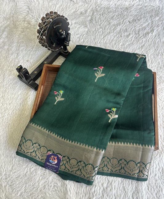 Banarasi Fancy Saree Forest Green Colored Complemented with a Silver Zari Border.