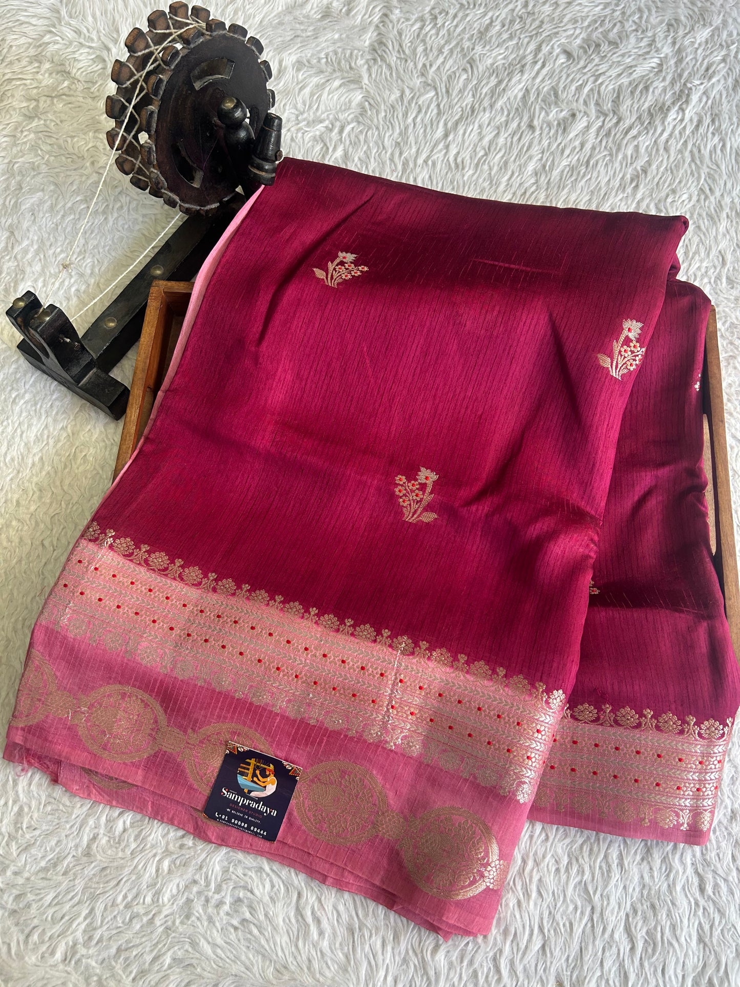 Banarasi Fancy Saree Violet Colored Complemented with a Silver Zari Border.