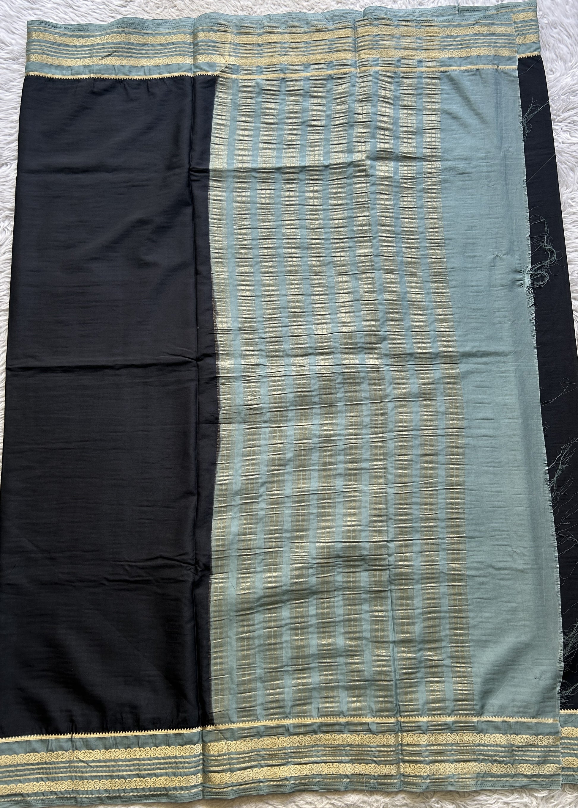 Semi Georgette Saree Elephant Gray Colored elegantly adorned with a Zari Border. - Sampradaya Designer Studio