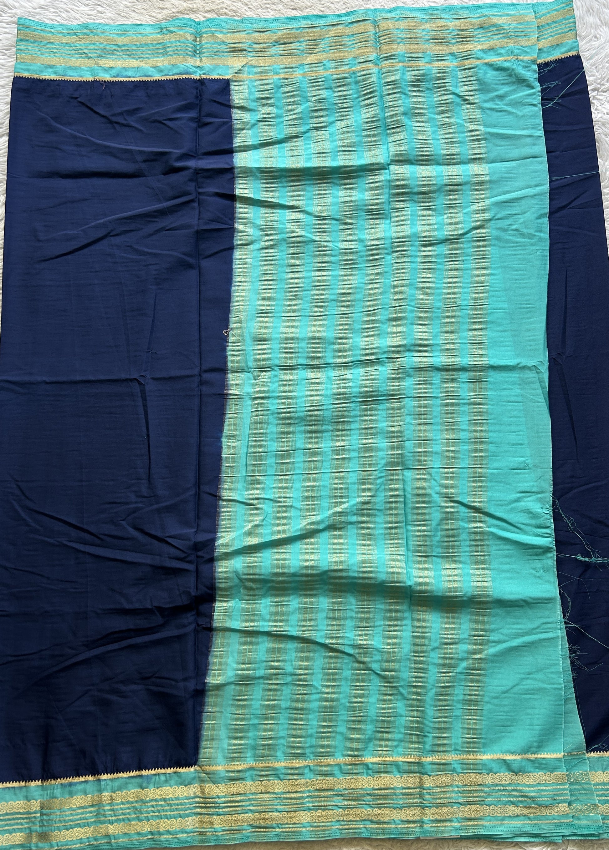 Semi Georgette Saree Royal Blue Colored elegantly adorned with a Zari Border. - Sampradaya Designer Studio