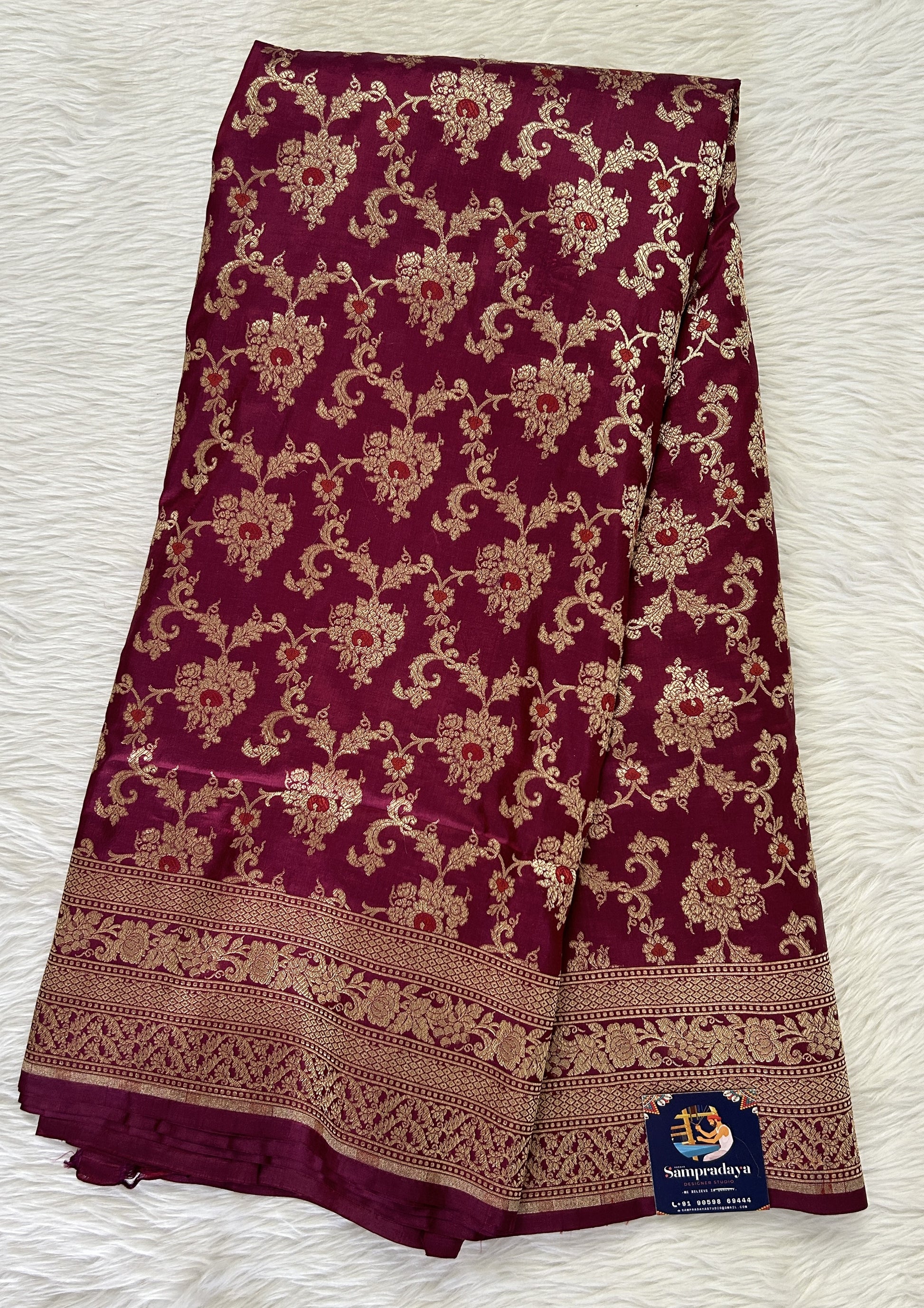 Banarasi Katan Silk Saree Magenta colored Saree complemented with a Gold Zari border. - Sampradaya Designer Studio