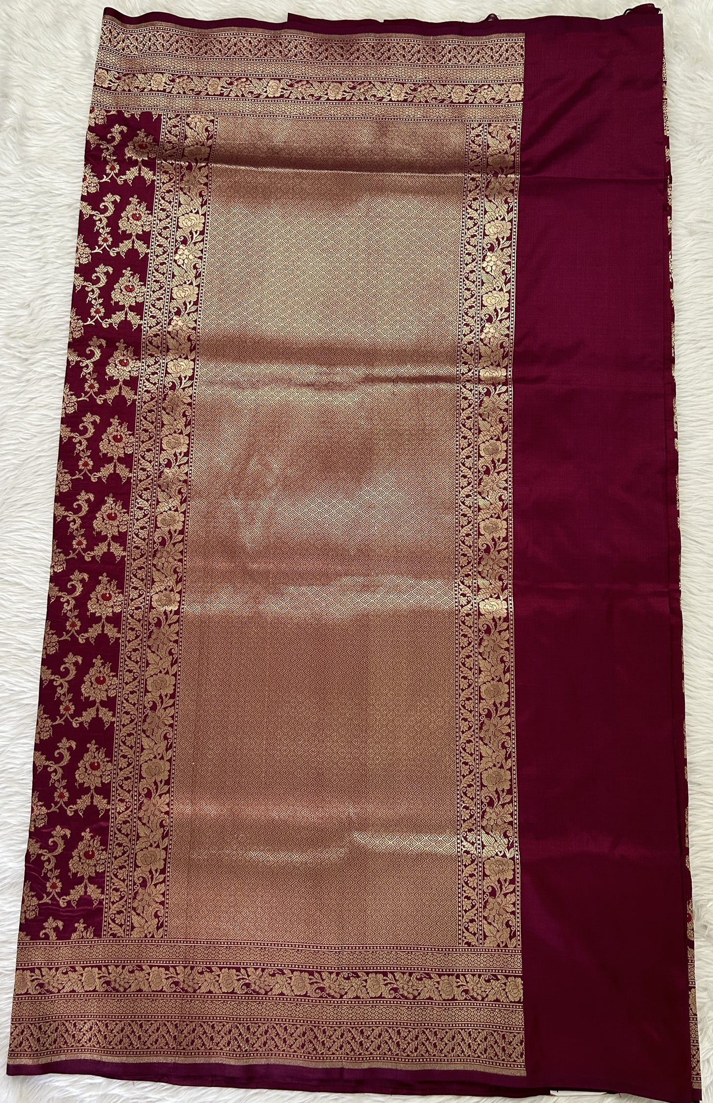 Banarasi Katan Silk Saree Magenta colored Saree complemented with a Gold Zari border. - Sampradaya Designer Studio