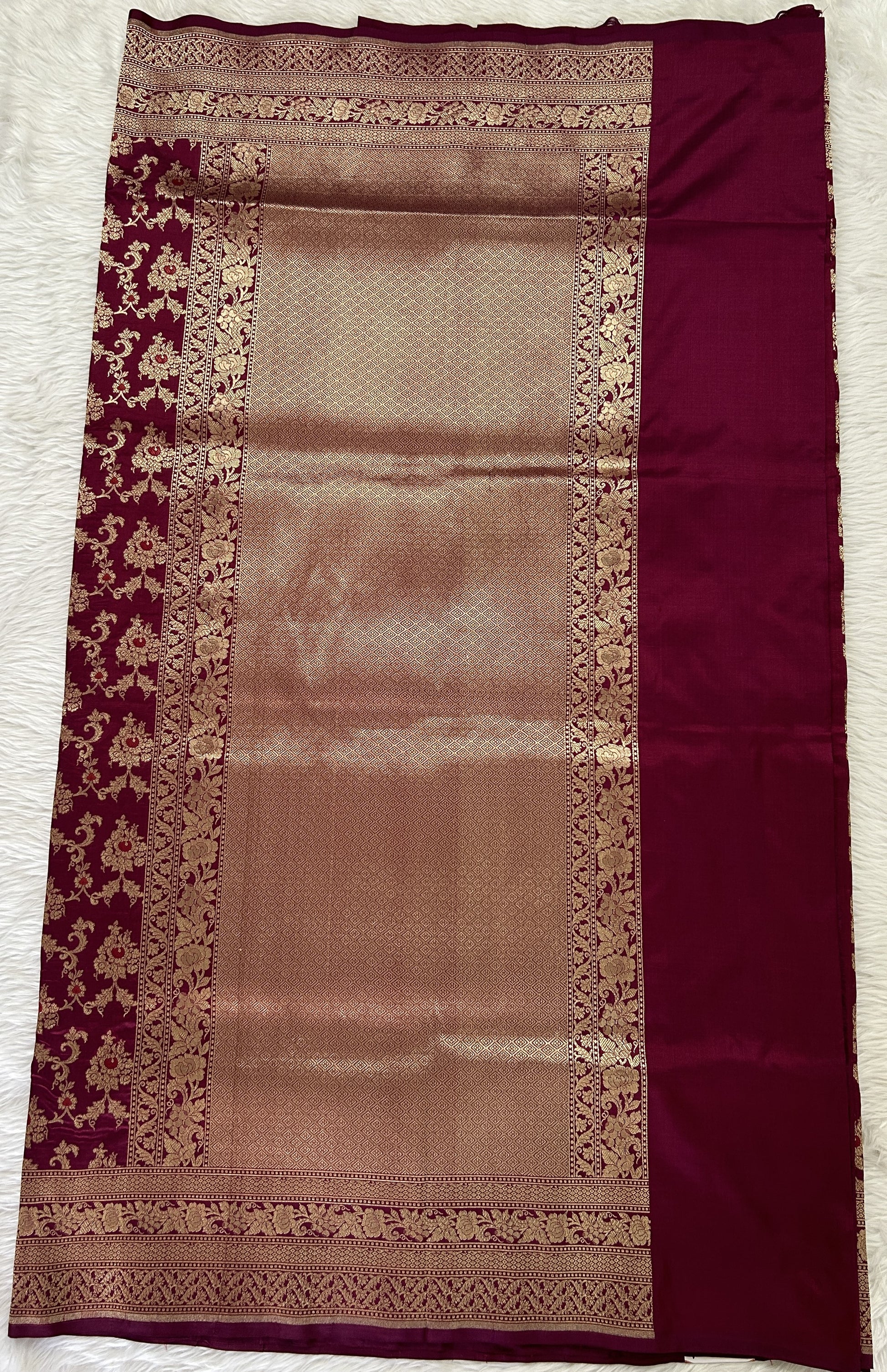 Banarasi Katan Silk Saree Magenta colored Saree complemented with a Gold Zari border. - Sampradaya Designer Studio