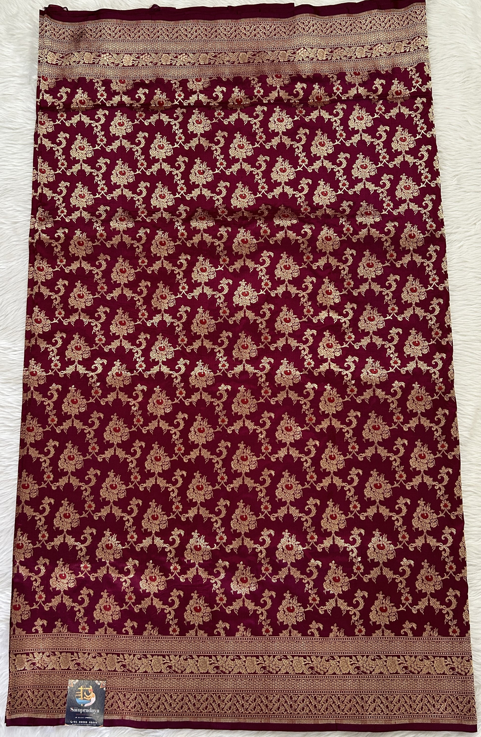 Banarasi Katan Silk Saree Magenta colored Saree complemented with a Gold Zari border. - Sampradaya Designer Studio