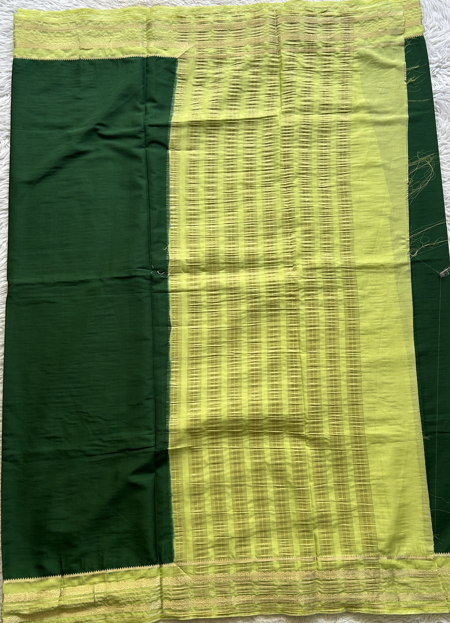 Semi Georgette Saree Dark Green Colored elegantly adorned with a Zari Border. - Sampradaya Designer Studio