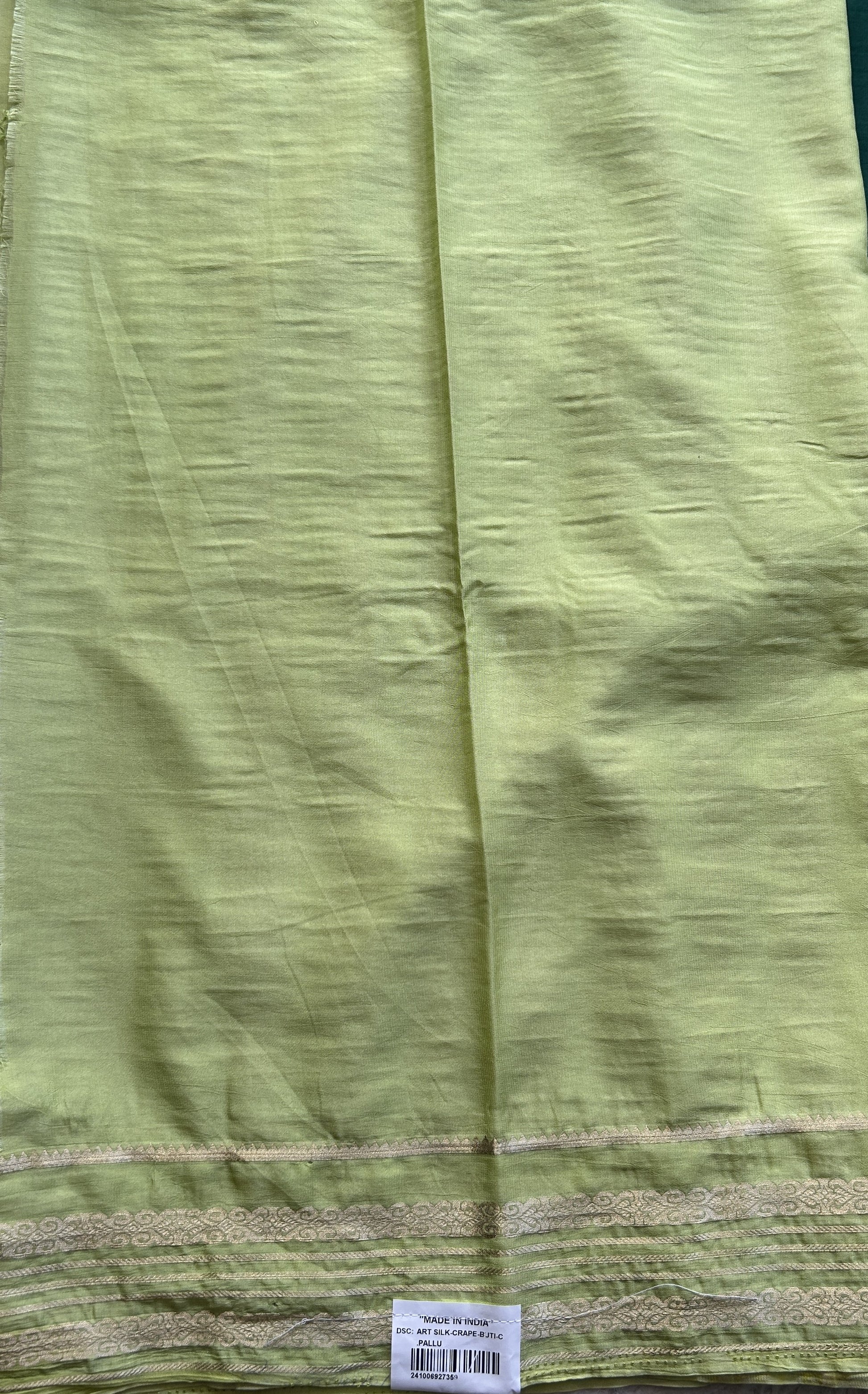 Semi Georgette Saree Dark Green Colored elegantly adorned with a Zari Border. - Sampradaya Designer Studio