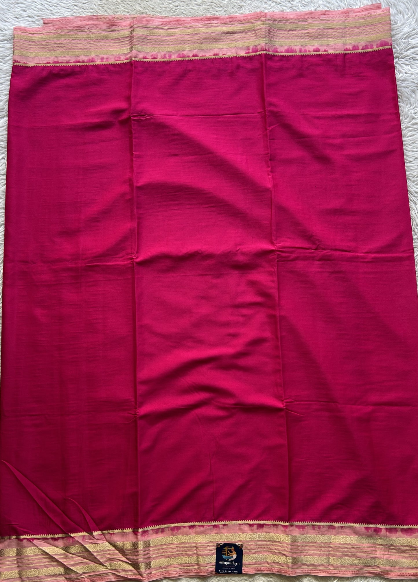 Semi Georgette Saree Pink Colored elegantly adorned with a Zari Border. - Sampradaya Designer Studio