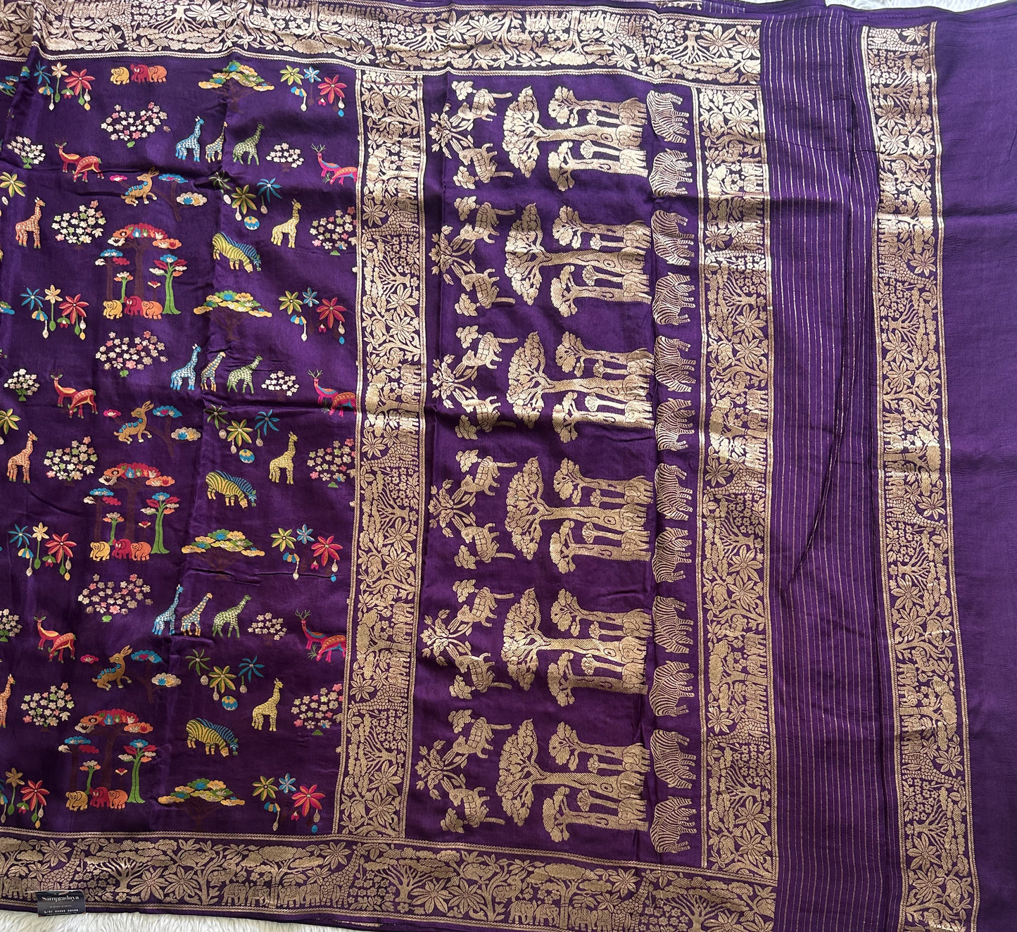 Banarasi Fancy Saree Metallic Purple Colored Complemented with a Gold Zari Border. - Sampradaya Designer Studio