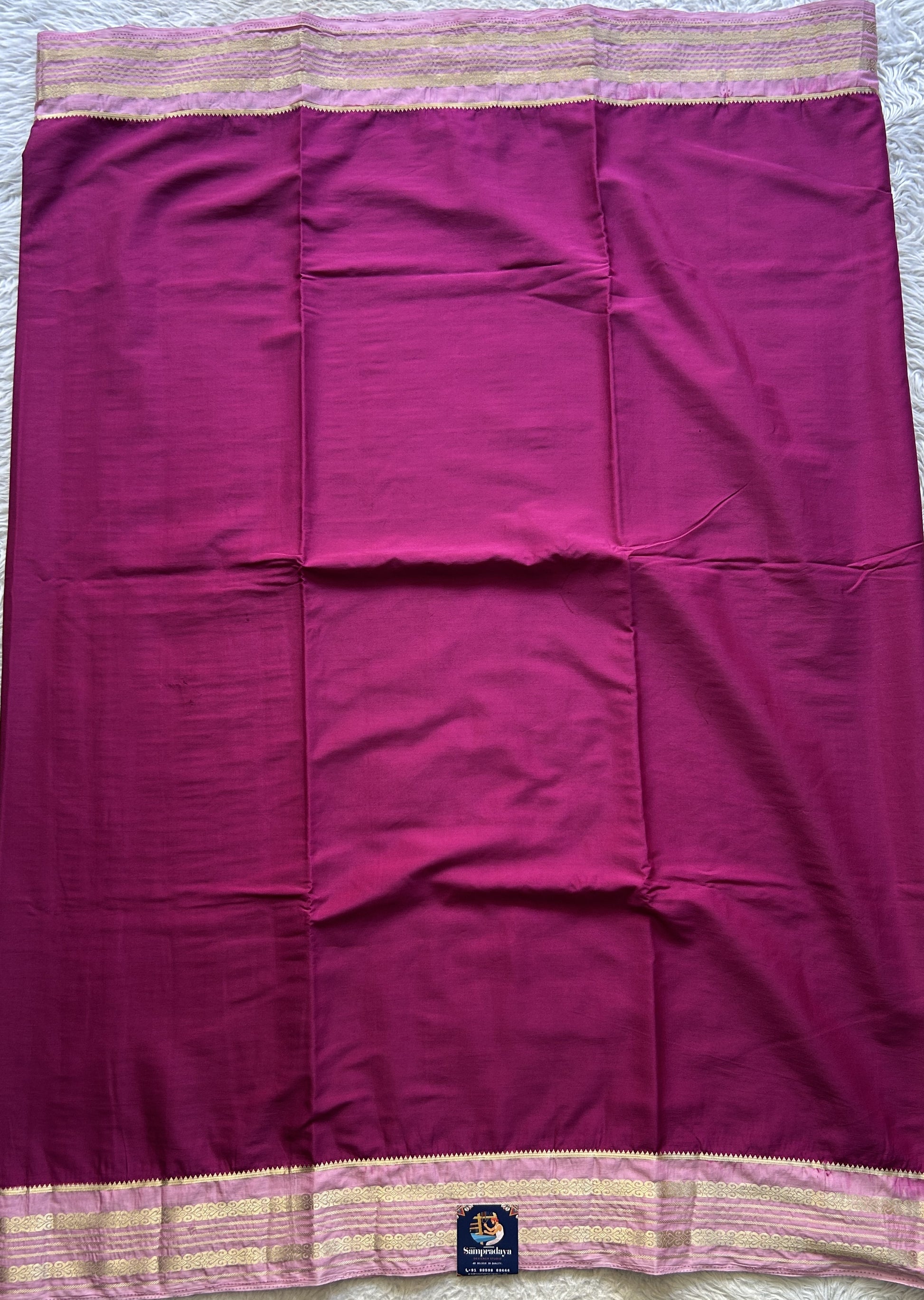 Semi Georgette Saree Mulberry Colored elegantly adorned with a Zari Border. - Sampradaya Designer Studio