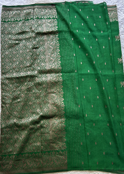 Semi Georgette Saree Green Colored elegantly adorned with a Zari Border. - Sampradaya Designer Studio