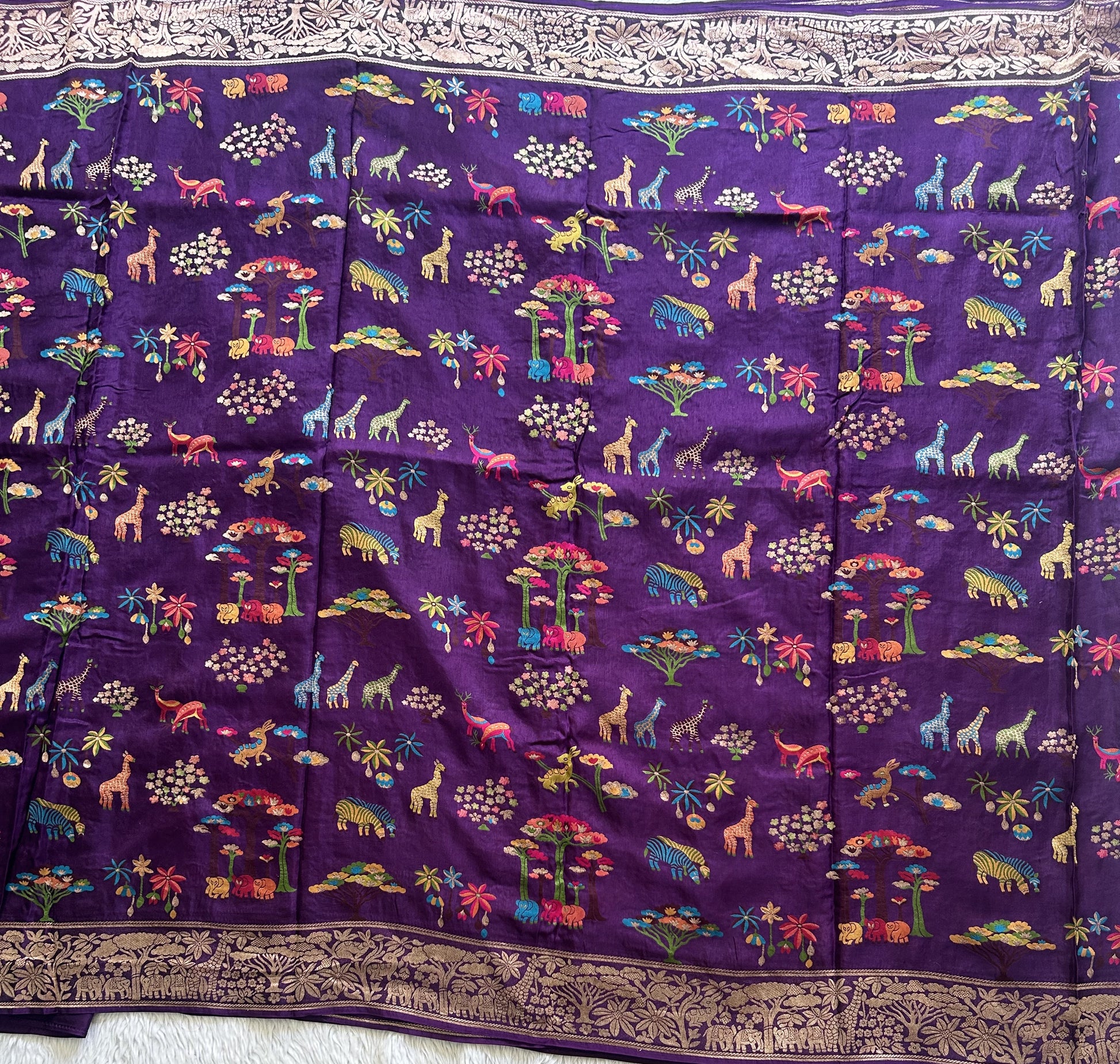 Banarasi Fancy Saree Metallic Purple Colored Complemented with a Gold Zari Border. - Sampradaya Designer Studio