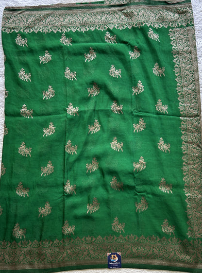 Semi Georgette Saree Green Colored elegantly adorned with a Zari Border. - Sampradaya Designer Studio