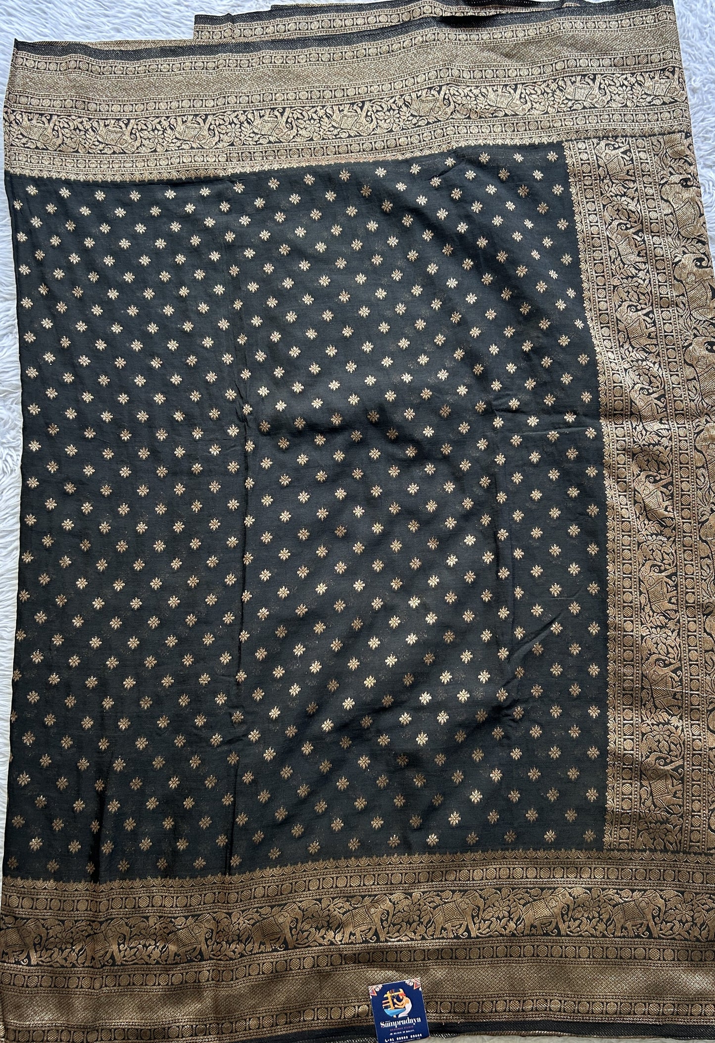 Semi Georgette Saree Black Colored elegantly adorned with a Zari Border. - Sampradaya Designer Studio