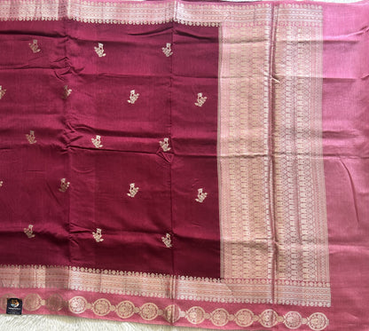 Banarasi Fancy Saree Violet Colored Complemented with a Silver Zari Border.