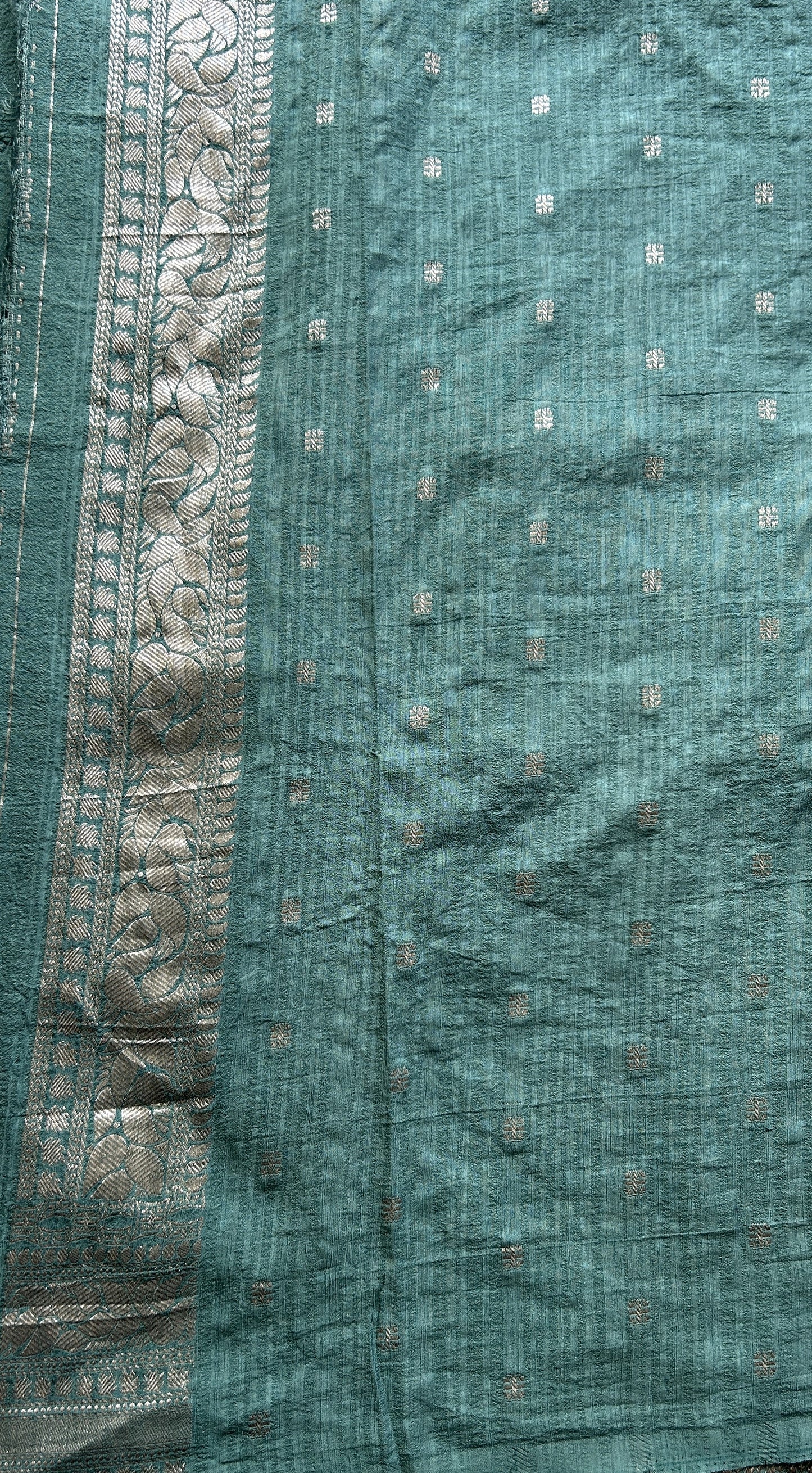 Semi Georgette Saree Sea Blue Colored elegantly adorned with a Zari Border. - Sampradaya Designer Studio